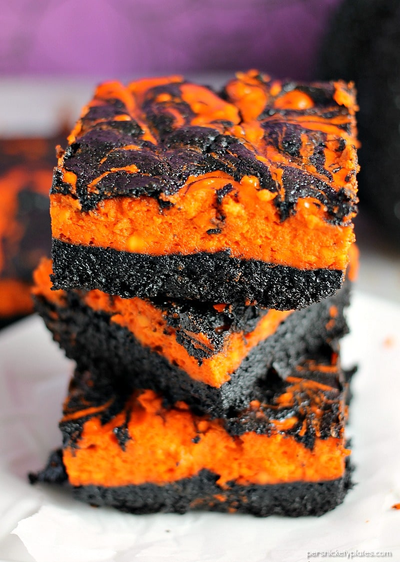 Creepy Crawlies Swirl Cream Cheese Brownies have a layer of rich, dark chocolate brownie topped with a layer of orange cheesecake then swirled together for a spooky treat