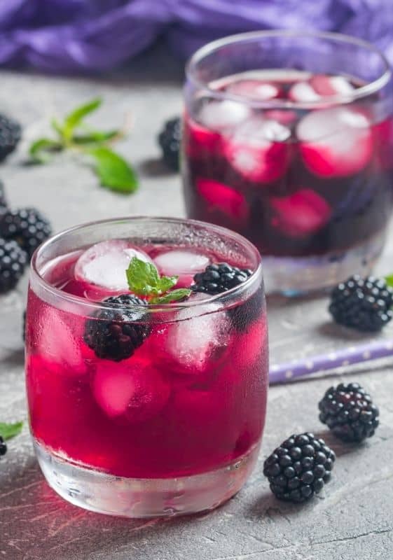 Two glasses of low carb blackberry lemonade.