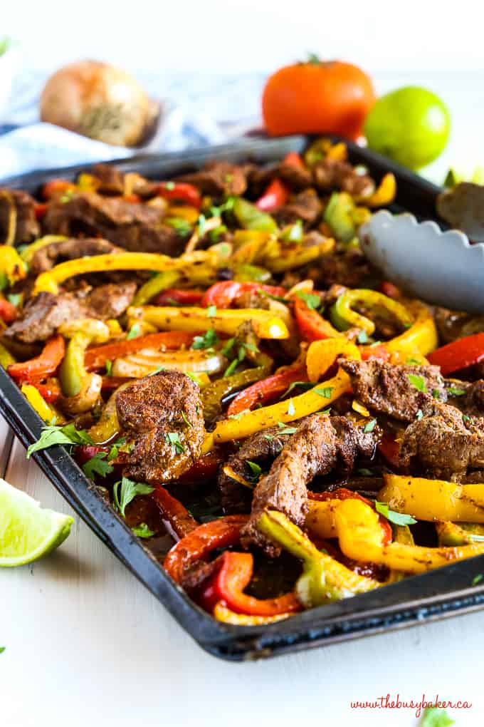 sheet pan steak fajitas with red and yellow peppers