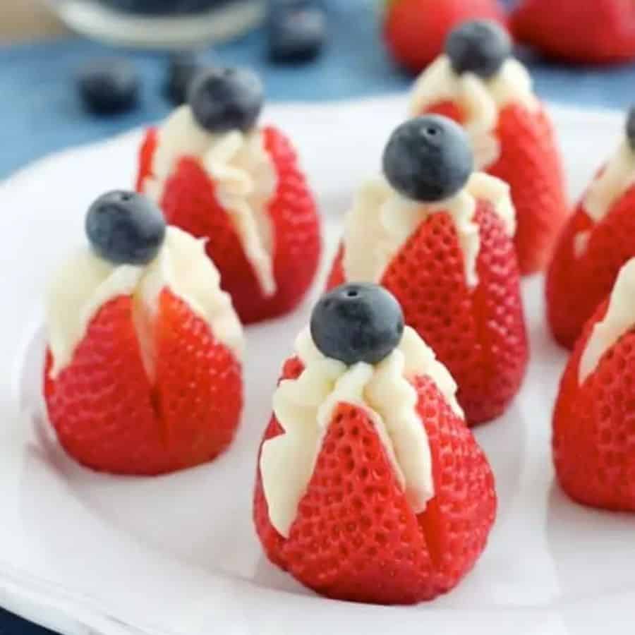 4th fo July strawberry Recipes. Cheesecake stuffed strawberries red white and boue american flag.