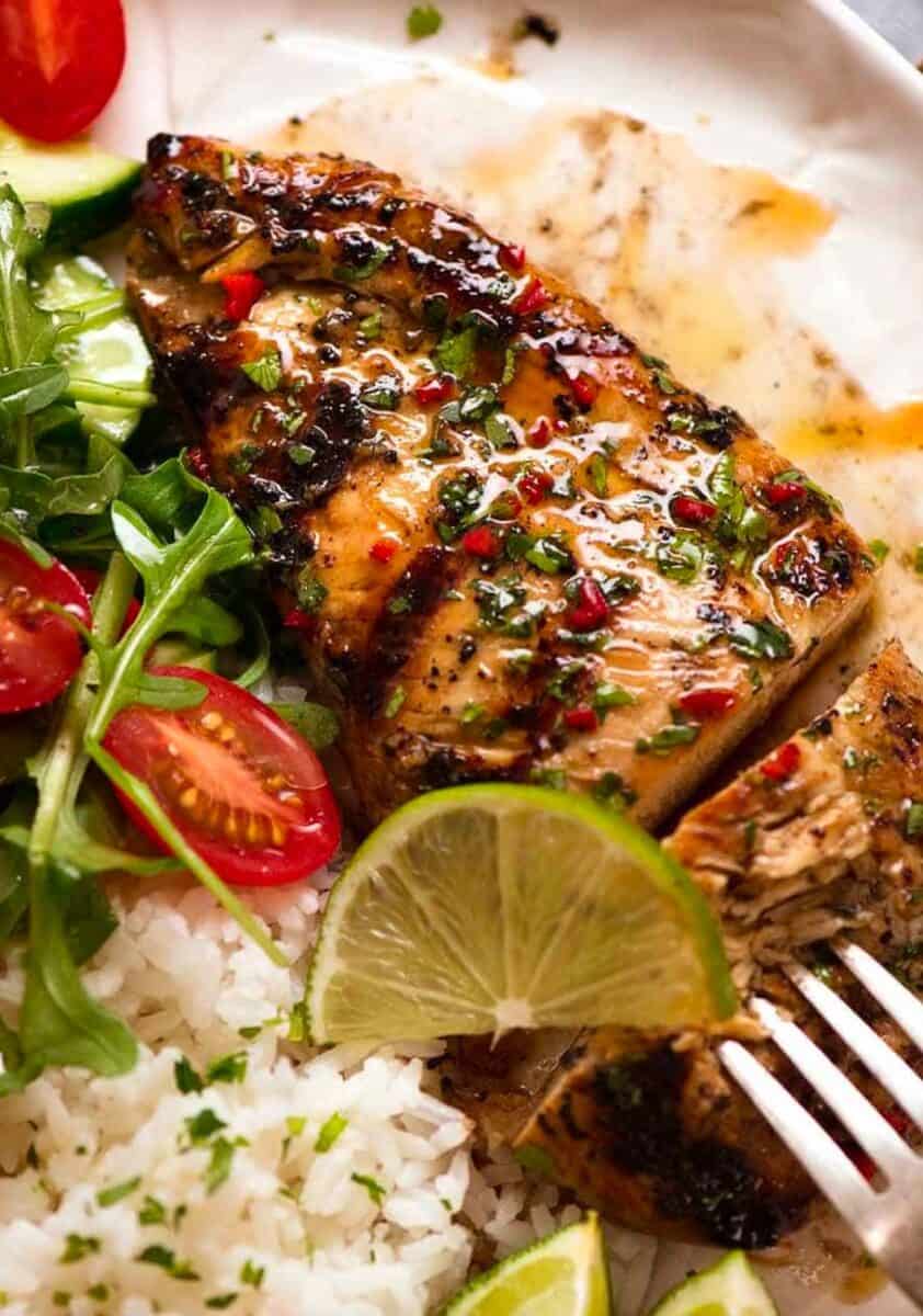 grilled chicken lime with white rice and salad.