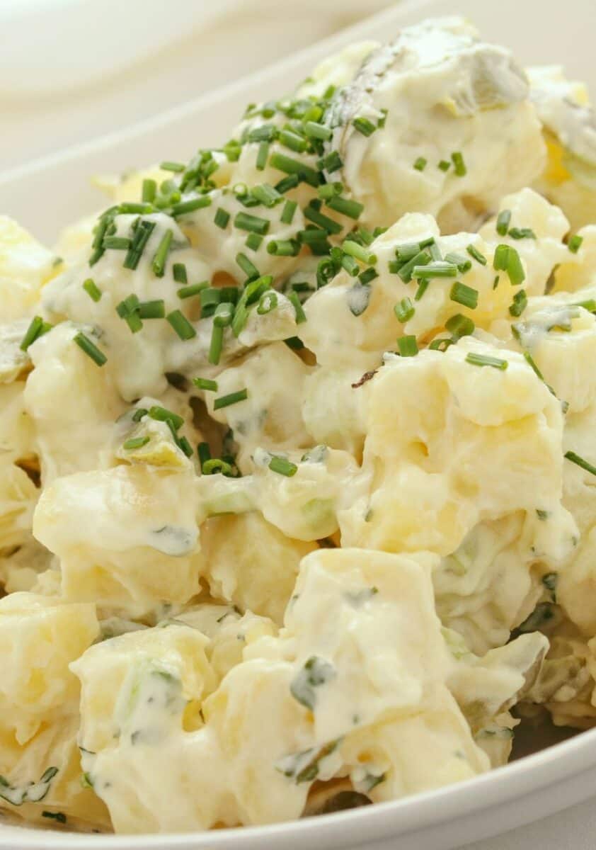 potato salad garnished with chives.
