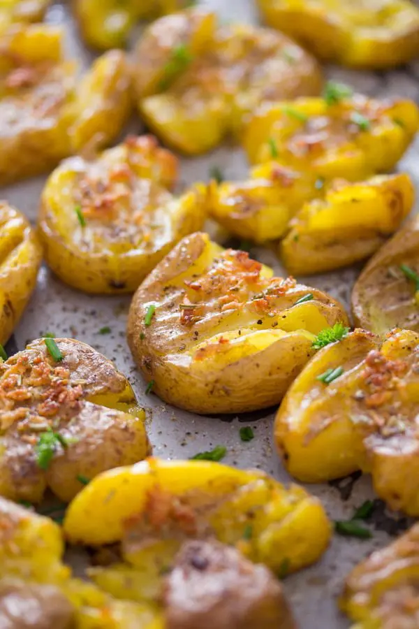 crispy garlic smashed potatoes with olive oil and rosemary.