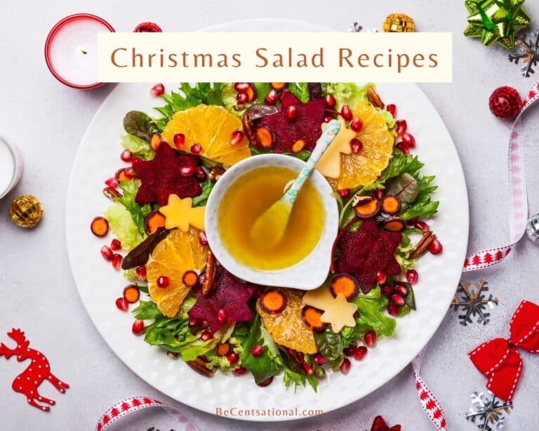 Christmas salad recipes. A Christmas salad with oranges, beetroot, apple and honey mustard sauce garnished with pomegranate seeds. served on a white plate on a white background.