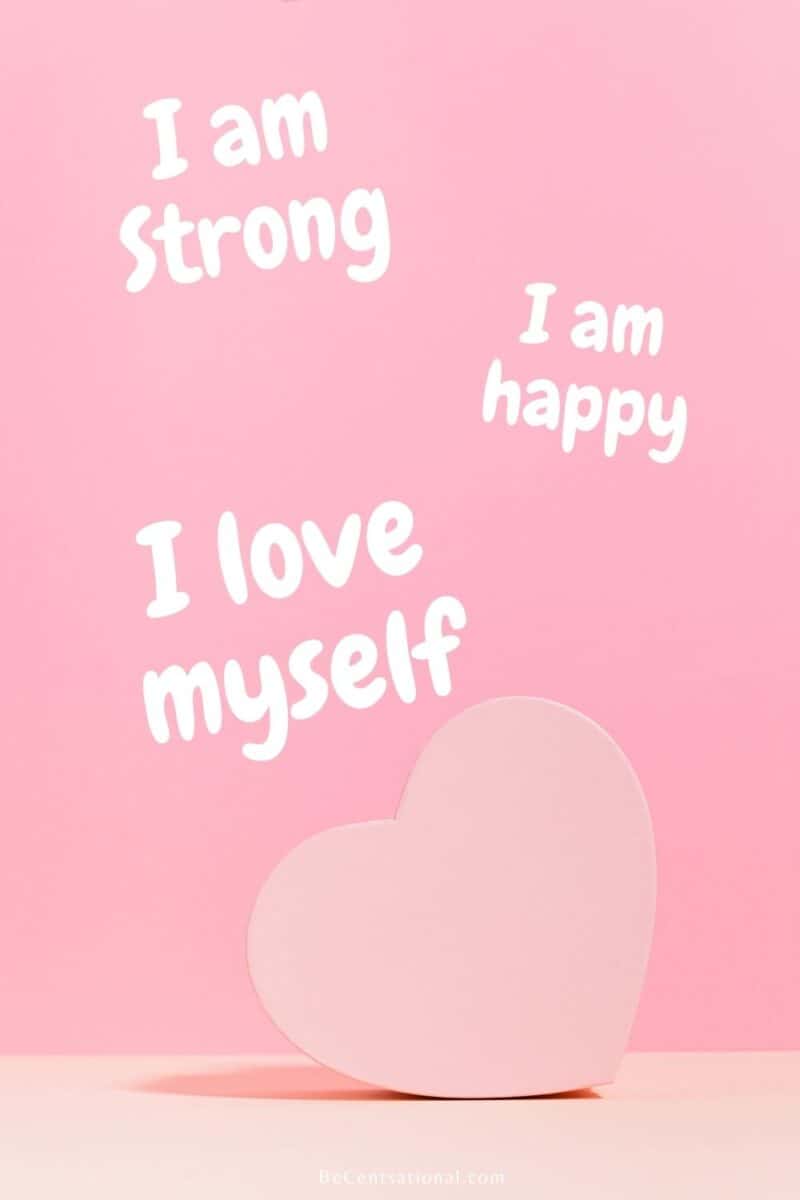 Self esteem affirmations in white letters on a pink background and a pink heart