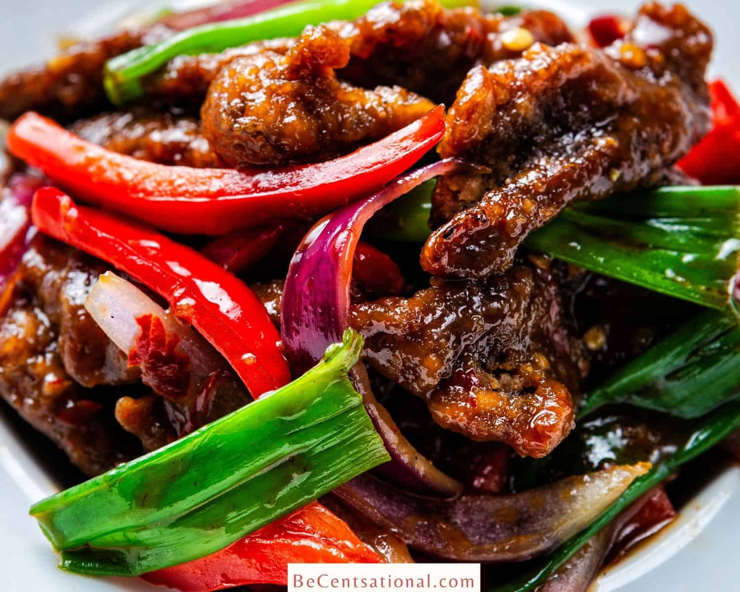 Best P.F. Chang’s Copycat Recipes showcasing Mongolian beef with red peepers and scallions.