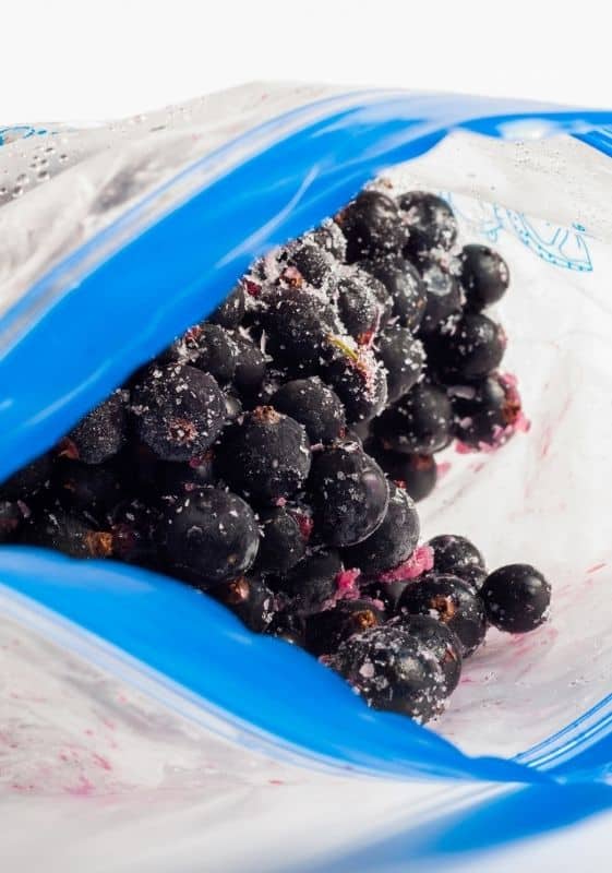 Frozen blueberries on a ziplock plastic bag.