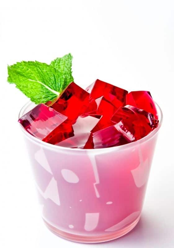 Strawberry jello in a cup.