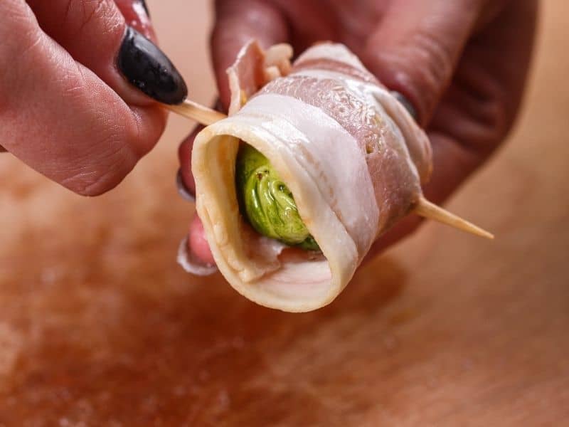 Wrapped bacon brussels sprout with toothpick holding in.