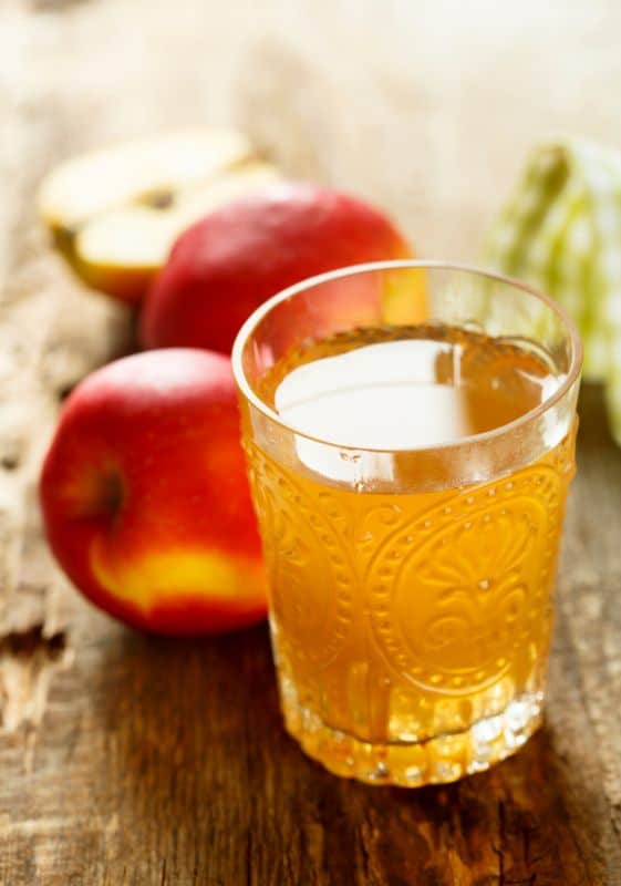 Glass of apple juice concentrate.