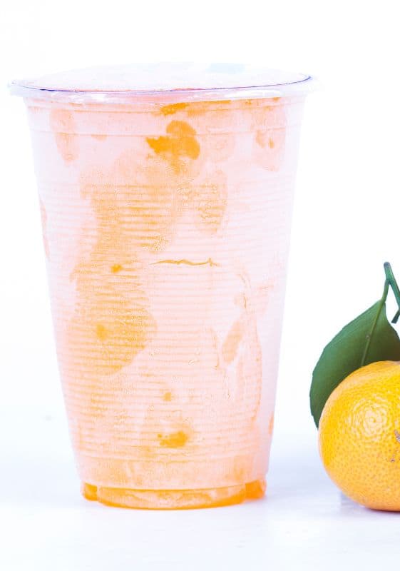 Frozen plastic cup of orange juice. How to Store Frozen Orange Juice Concentrate?