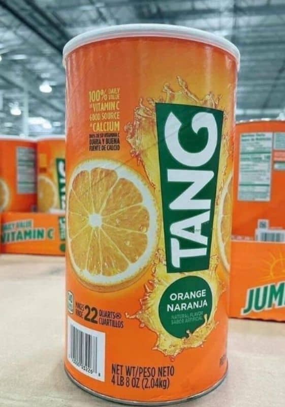 Side view of a canister of Tang orange drink.