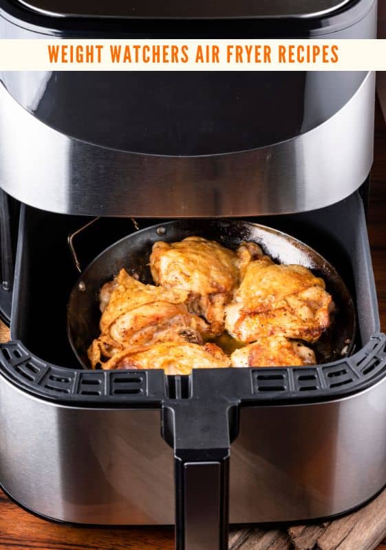 Weight Watchers Air Fryer Recipes, featuring chicken thighs inside an air fryer.