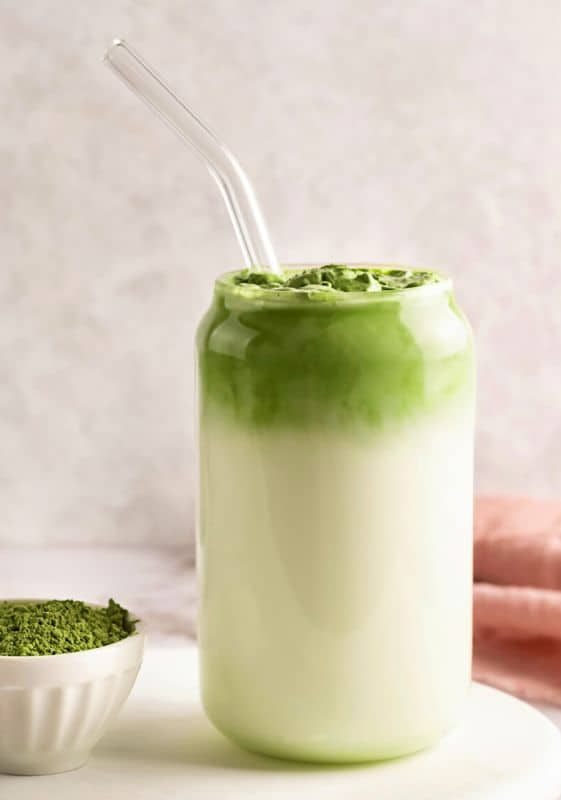 Matcha latte in a tall glass.