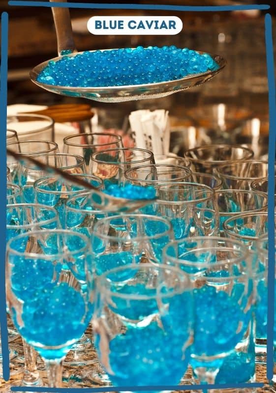 Natural blue caviar being served in glass crystals.