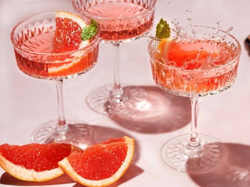 3 Strawberry Grapefruit Vodka Cocktails with grapefruit as garnish. This Strawberry Grapefruit Vodka Cocktail is a delicious and refreshing summer beverage. An easy to make low calorie cocktail!