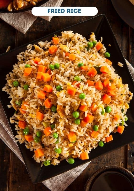 Fried rice on a black plate. Saturday dinner ideas.