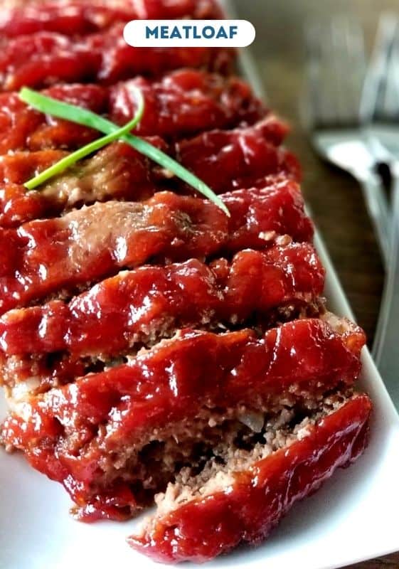 Sliced Meatloaf on a white plate.