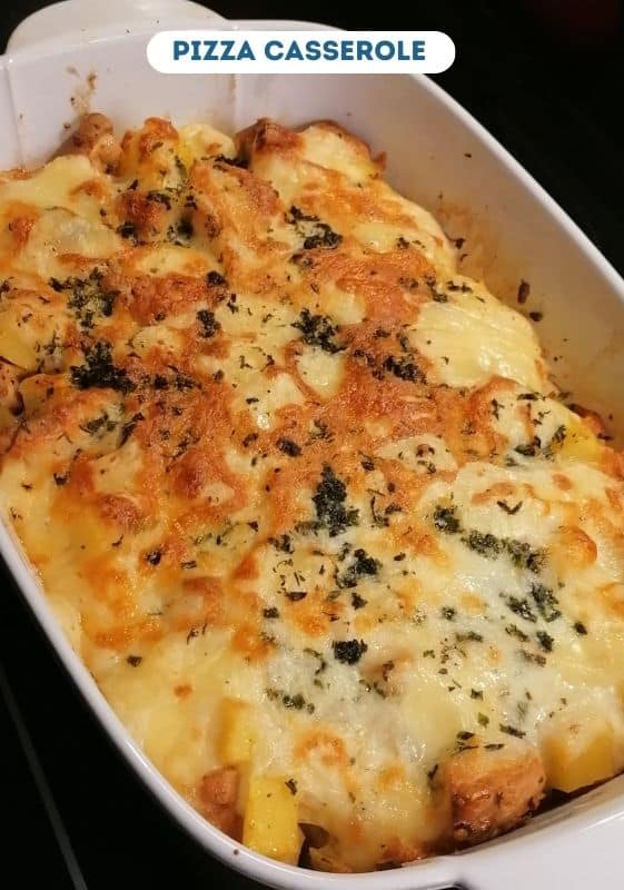Pizza casserole on a white baking dish. A great idea for Saturday dinners.