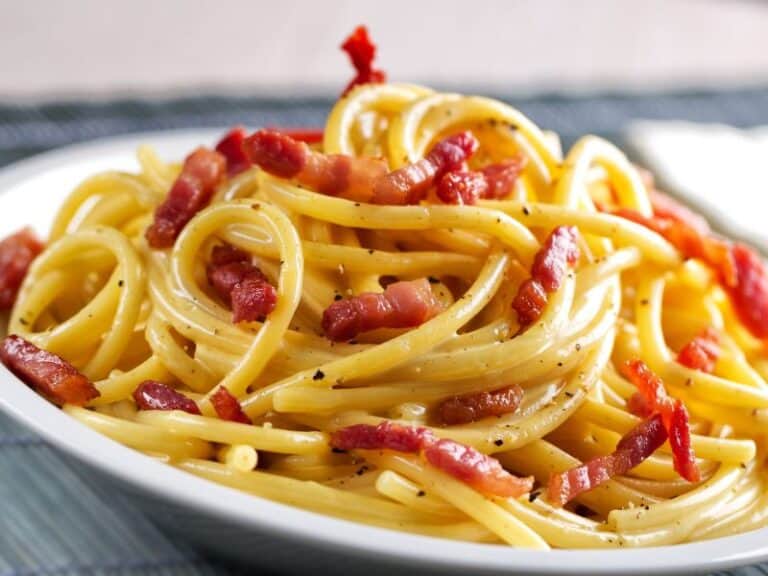 Cream Cheese Pasta with Bacon. A delightful and creamy pasta dish topped with crispy bacon lardons and a touch of black pepper.