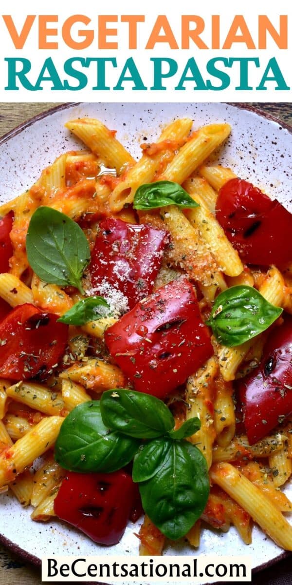 Vegetarian Rasta Pasta - A vibrant dish of penne pasta coated in a creamy tomato sauce with colorful bell peppers and aromatic jerk seasoning, creating a burst of flavors on the plate.