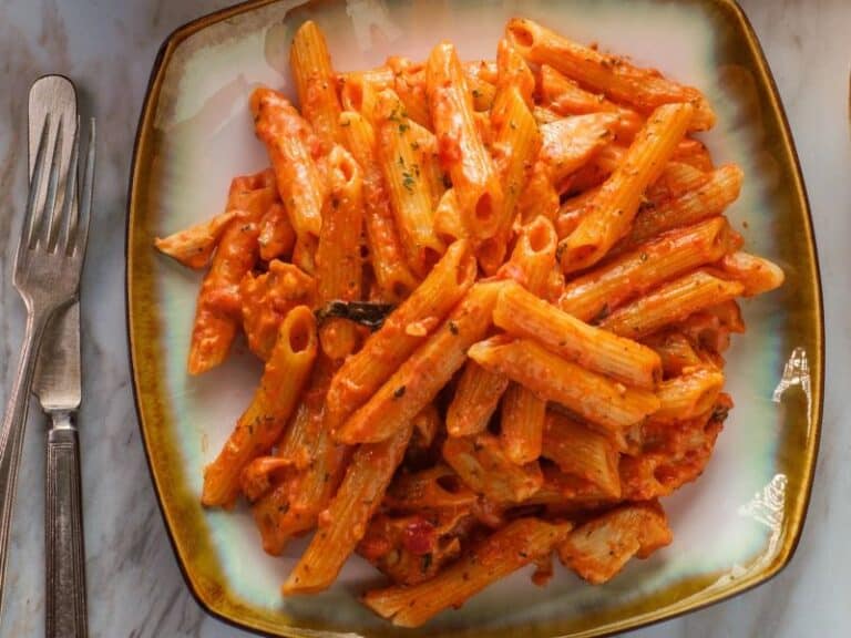 Chicken Penne alla Vodka dish on a white plate, highlighting the creamy tomato vodka sauce and succulent chicken pieces.