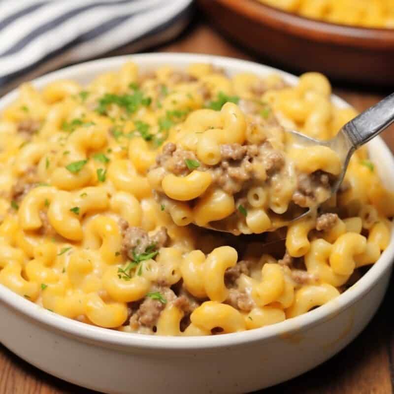 Creamy Hamburger Mac and Cheese served in a white casserole dish.