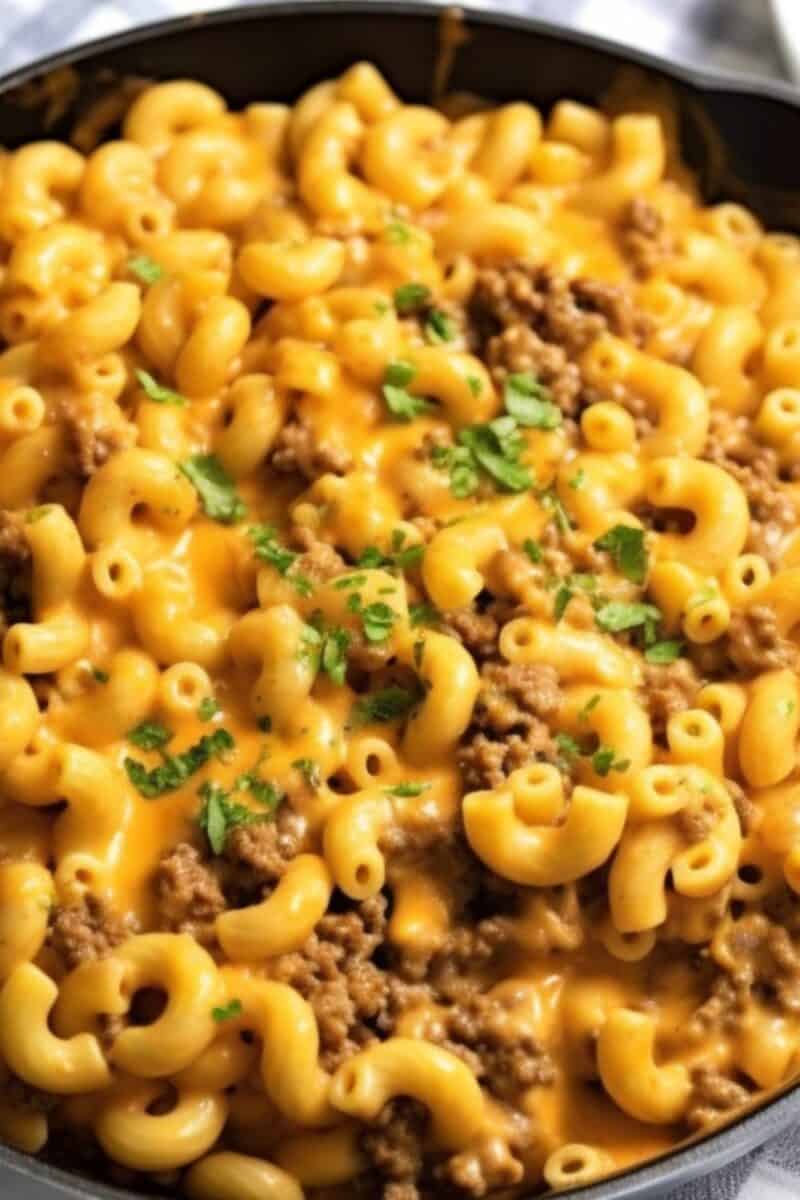 Close-up shot of cheesy macaroni casserole with ground beef, perfect for an easy weeknight dinner idea.