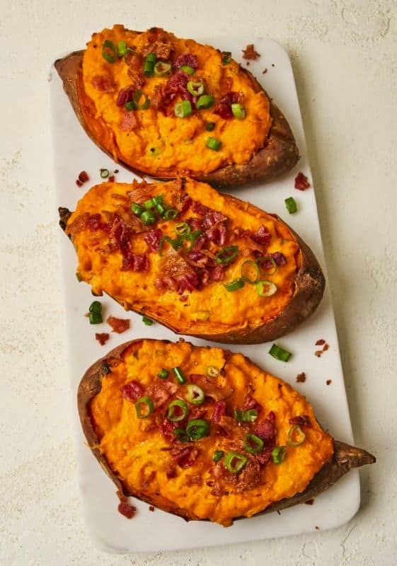 twice baked sweet potatoes topped with bacon and scallions