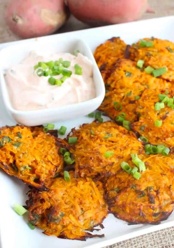 Baked sweet potato fritters are a delicious and healthy recipe. This dish is a perfect side dish or appetizer. This sweet potato fritter recipe is perfect to make in the fall or any time of the year.