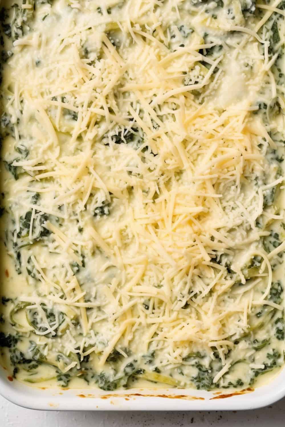Spinach gratin mixture in a baking dish.