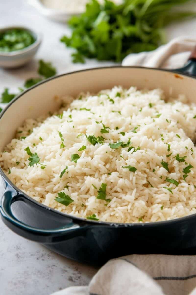 A pan full of bright and zesty Cilantro Lime Rice, perfectly cooked and garnished with fresh cilantro leaves, embodying the authentic Mexican recipe taste.